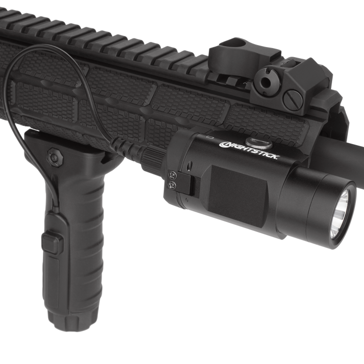 Black firearm with attached flashlight on a white background