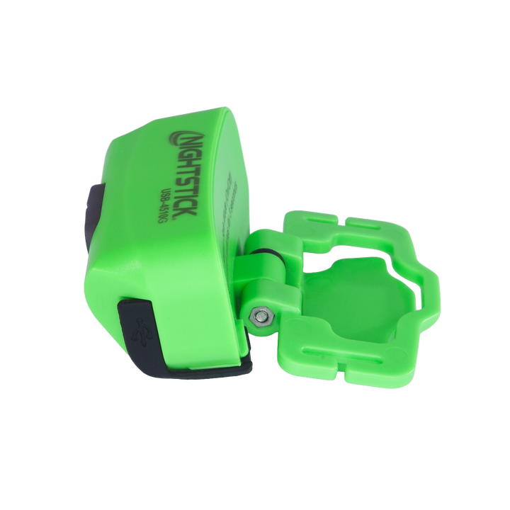 Green flashlight with clip on a white background