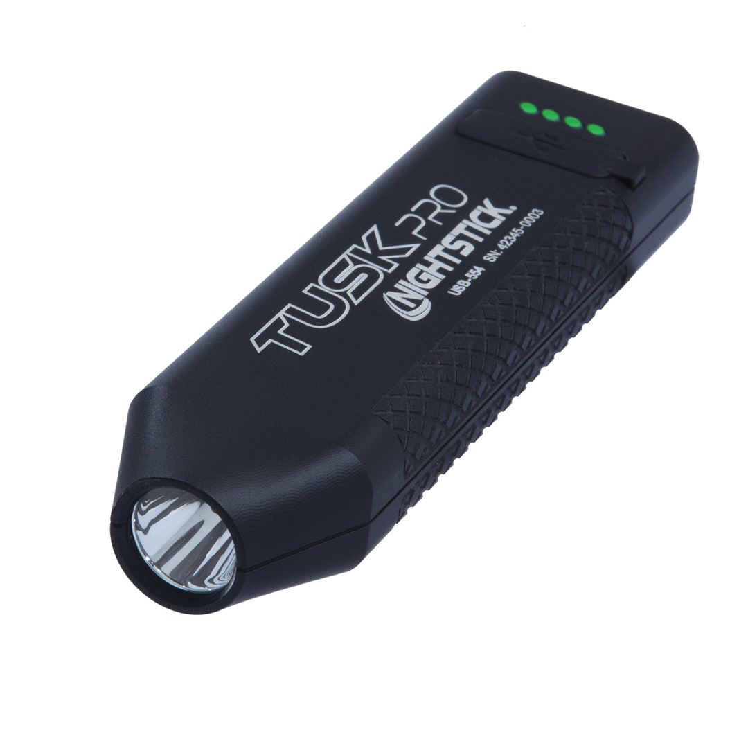 Black flashlight with 'Tusk Pro Nightstick' branding on a white background