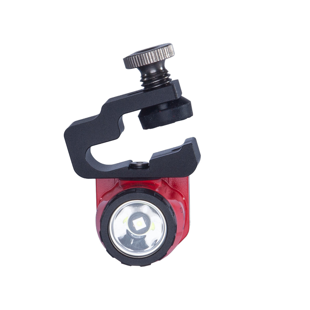 Red light with black clamp on a white background