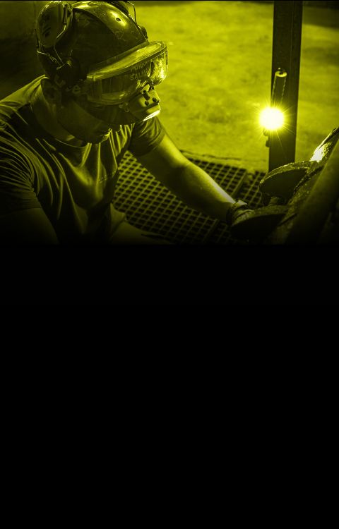 workman using Nightstick headlamp to light up his work area
